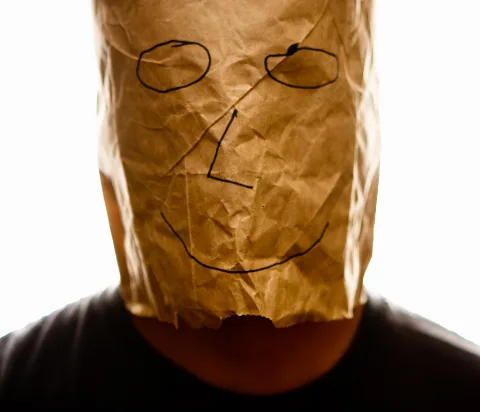 Brown Paper Bag With Happy Smiley Over Head