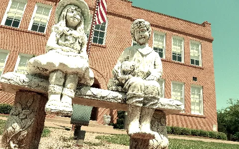 Children Statues Front Building