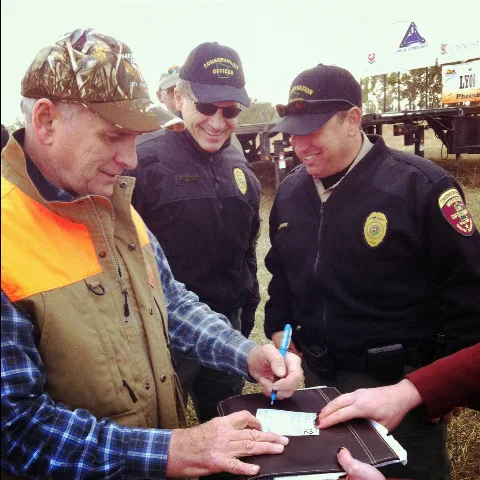Governor Of Minnesota Governor Dayton Signs His 2012 Hunting License (8091197391)