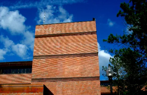 Uf Marston Science Library Brick Red Blue Sky Clouds Tree Light Pole (4662102094)