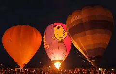 Hot Air Balloons Glowing In The Evening At Lift Off Levin Night Glow