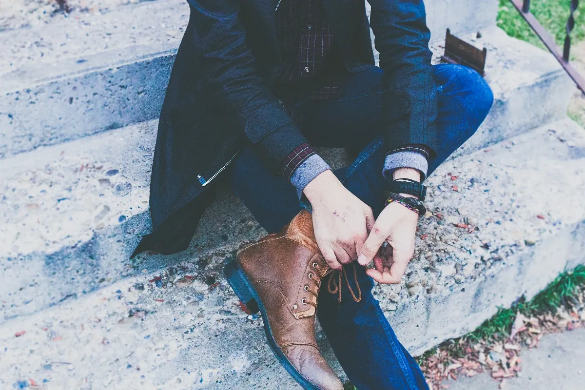 Elegant Man Tying Shoes (Unsplash Ryvaxaojo2Q)