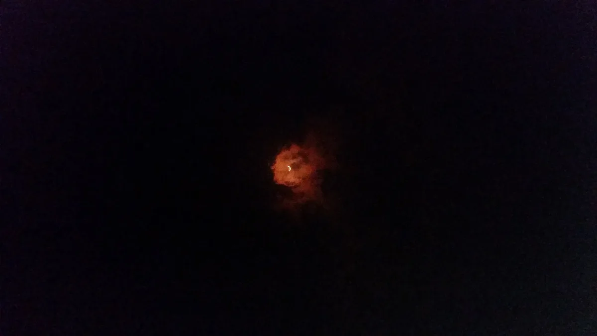 Solar Eclipse Through Man Shaped Cloud, August 21, 2017